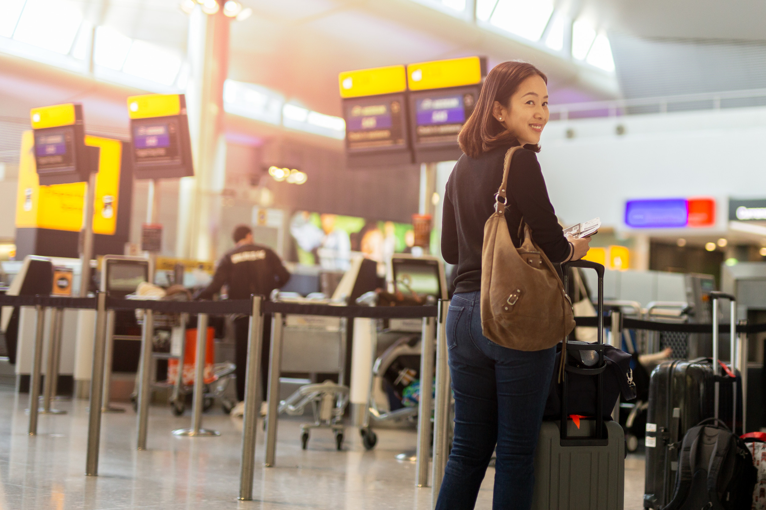 happy woman with smile hand holding passport and boarding pass happy woman with smile hand holding passport and boarding pass