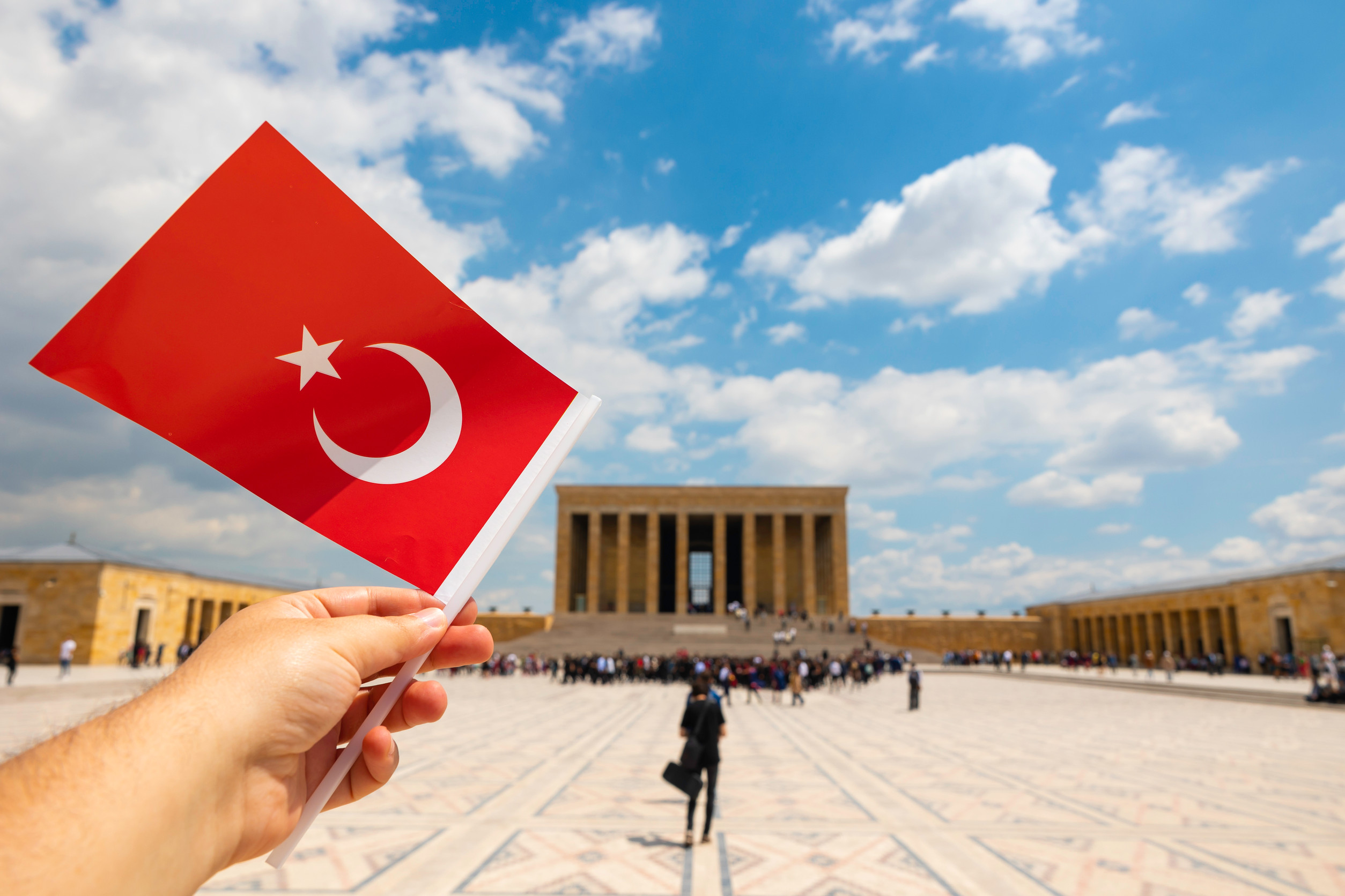 turkish national holidays man waving a turkish flag in anitkabir in ankara turkish national holidays man waving a turkish flag in anitkabir in ankara