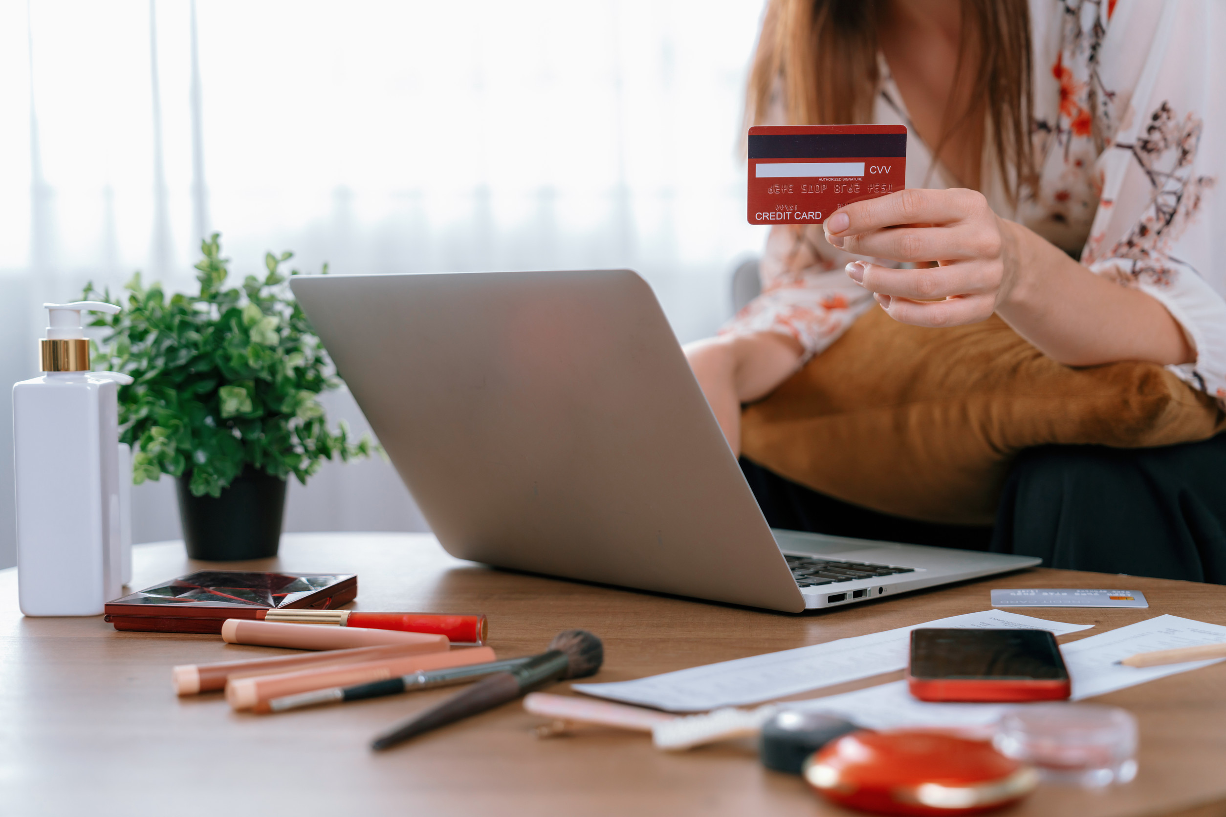 young happy woman buy product by online shopping at home while ordering items from the internet young happy woman buy product by online shopping at home while ordering items from the internet